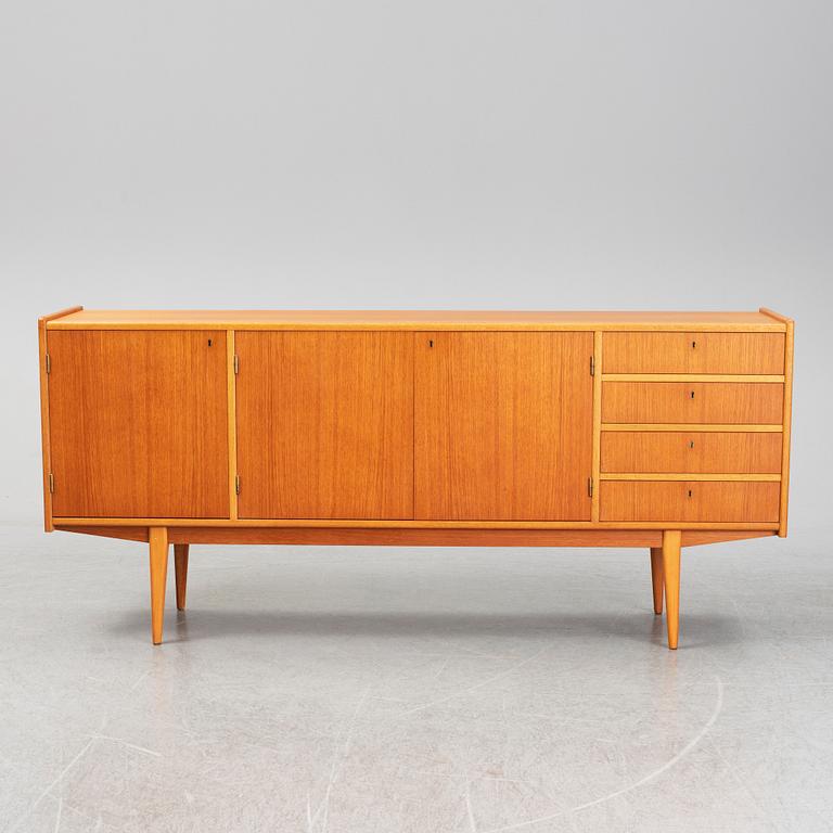 A second half of the 20th century teak veneered sideboard.