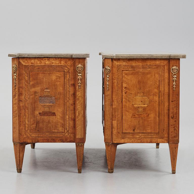 A matched pair of Gustavian ormolu-mounted limestone topped and marquetry commodes by C. Lindborg, late 18th century.