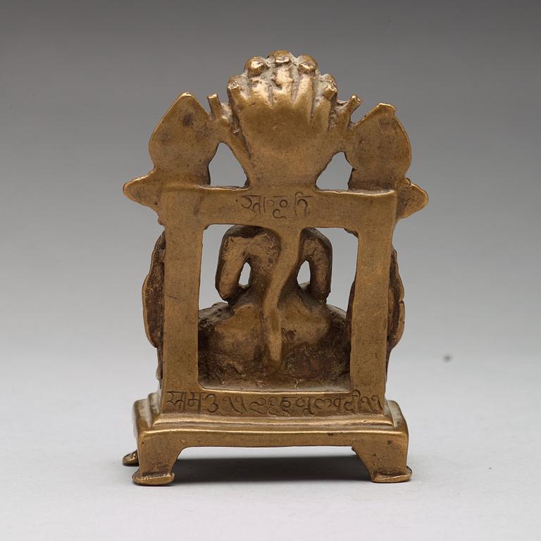 A copper alloy Jain shrine, western India, 19th Century or older. With inscription to the back.