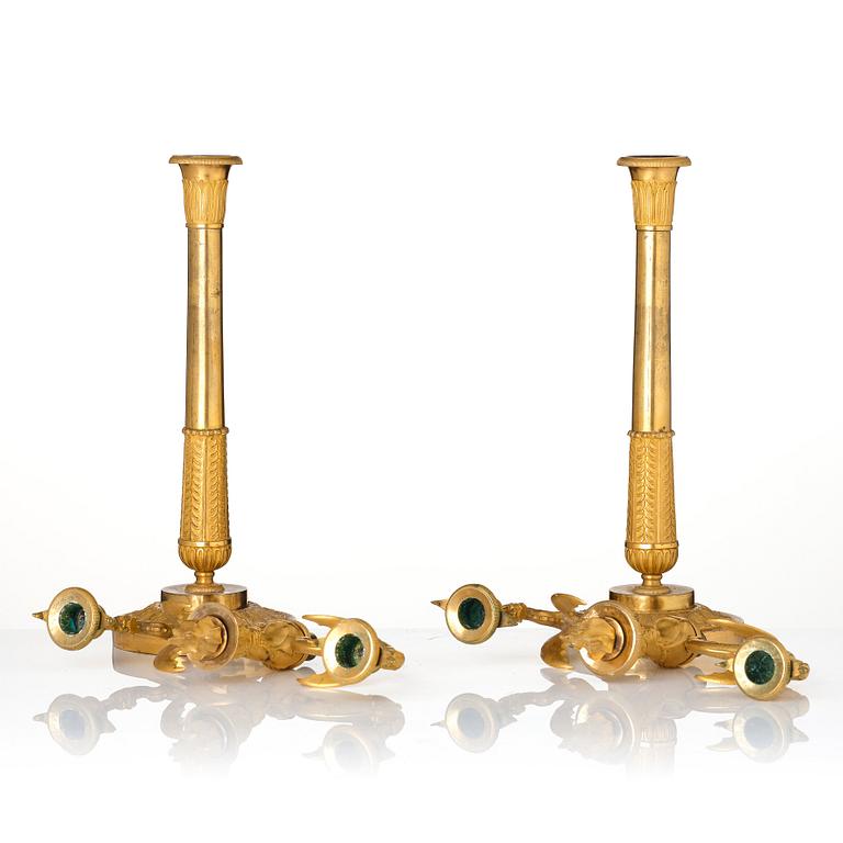 A pair of ormolu three-branch Empire candelabra, early 19th century.