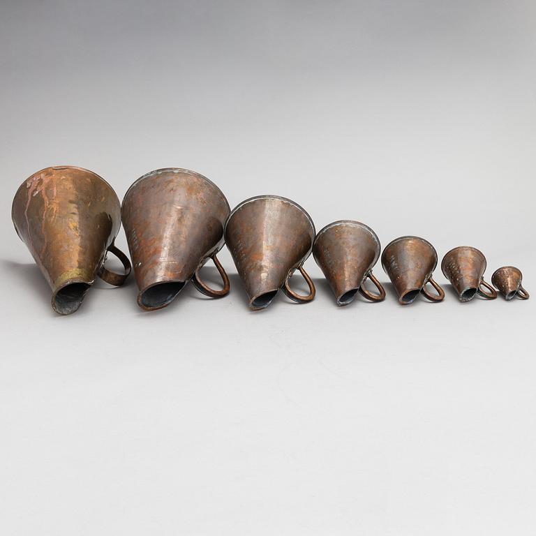 7 Swedish measuring cups from 20th century.