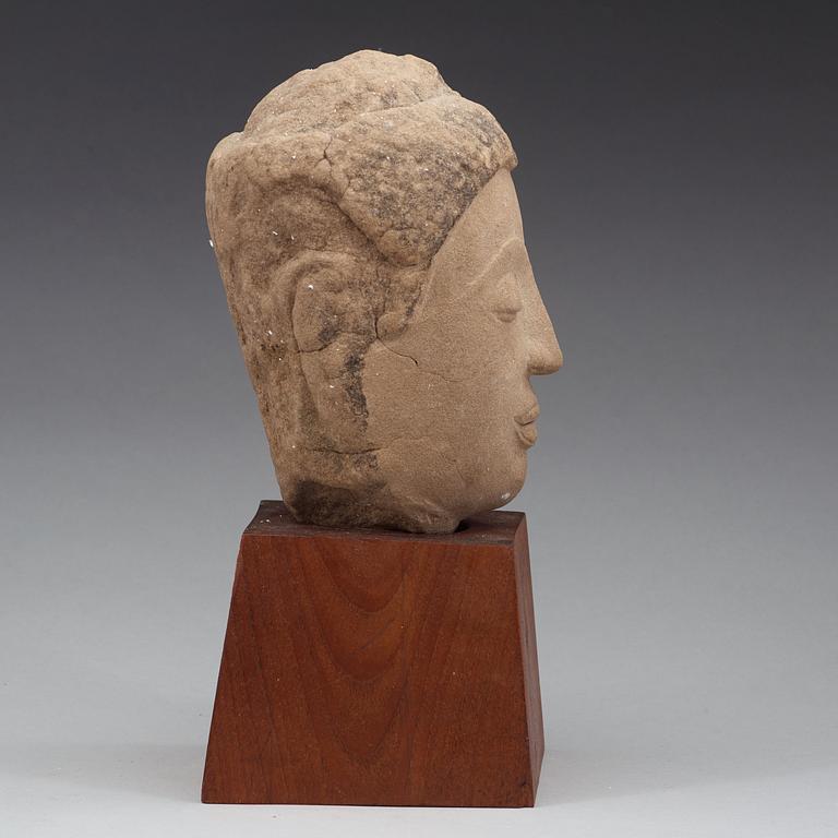 A Thai sandstone head of Buddha, 18/19th Century.