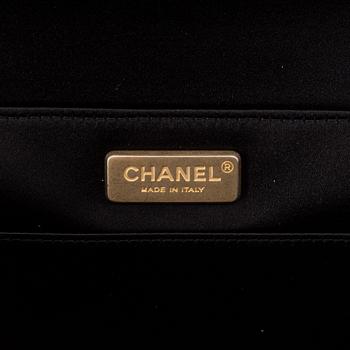 Chanel, a black satin clutch, 2019.