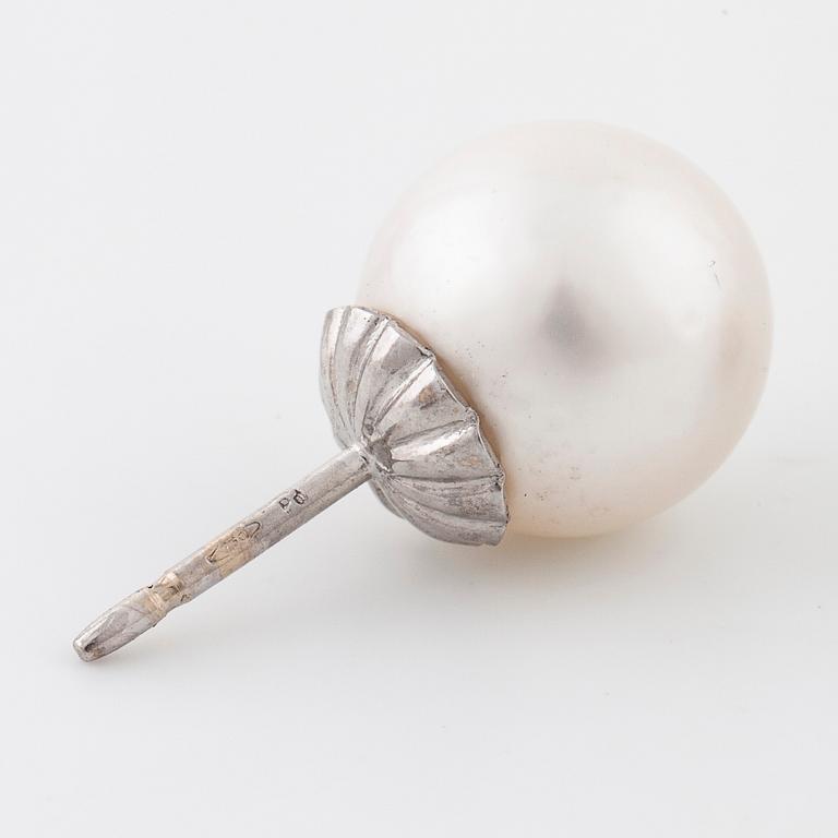 A pair of cultured pearl earrings.
