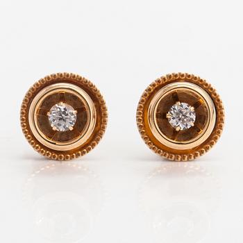 Elis Kauppi,  A pair of 14K gold buttons with rock crystals to a white tie shirt. Kupittaan kulta, Turku.