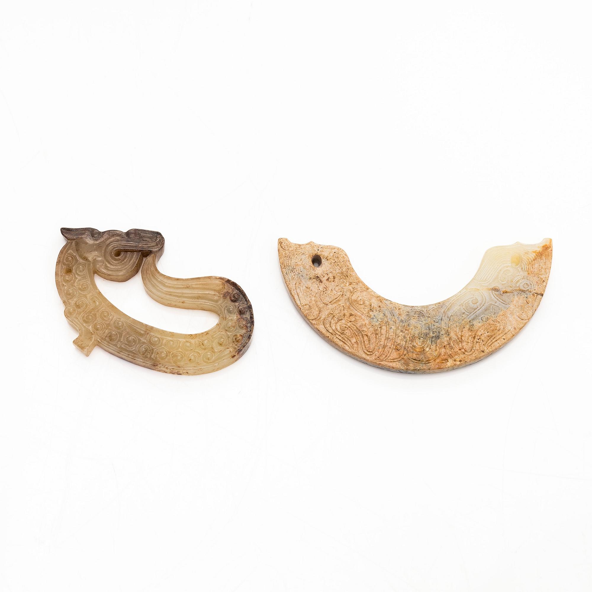 Two archaistic nephrite ornaments, 20th century.