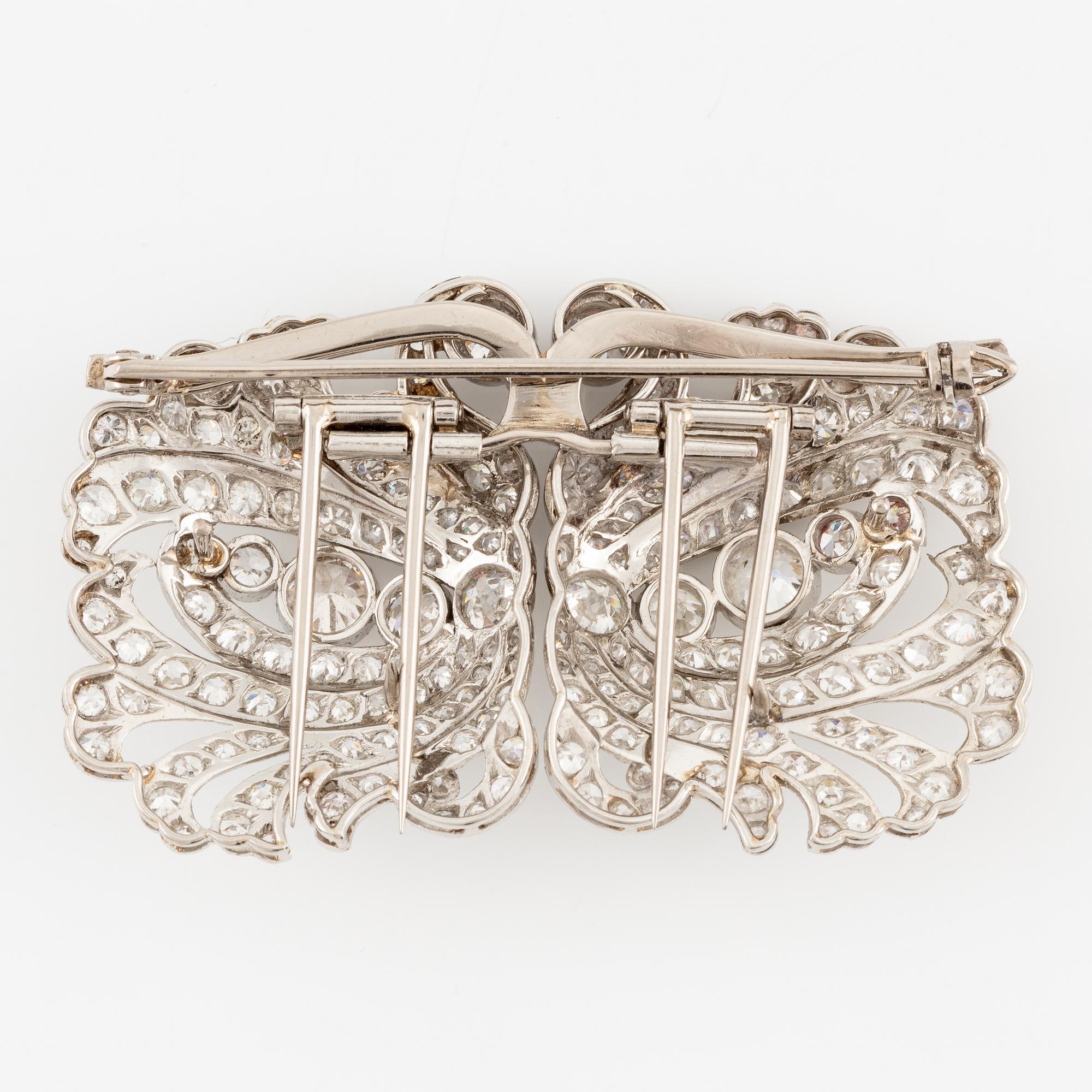 A brooch/double clip in platinum set with old- and eight cut diamonds.