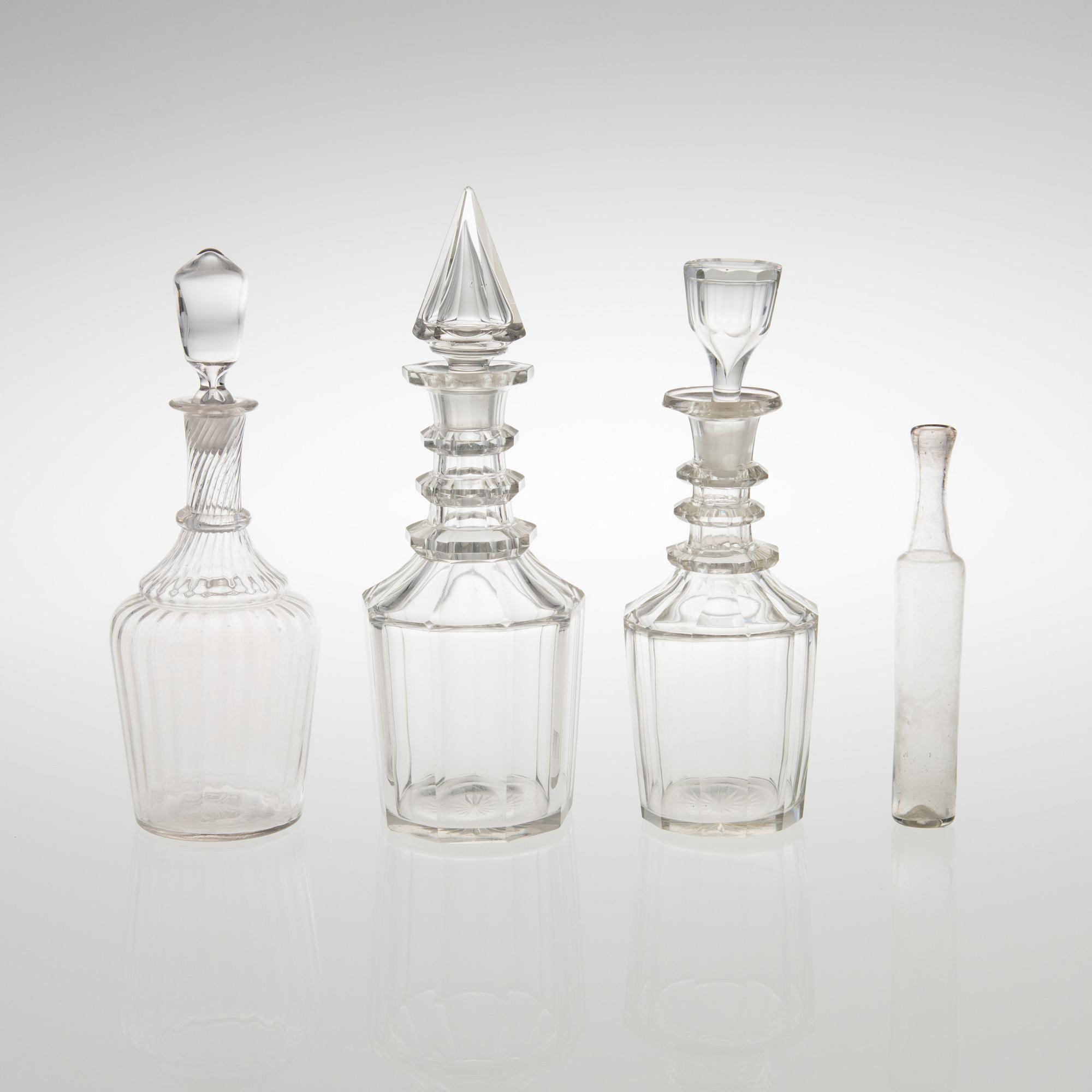 Three carafes and a glass bottle from the end of the 19th century.