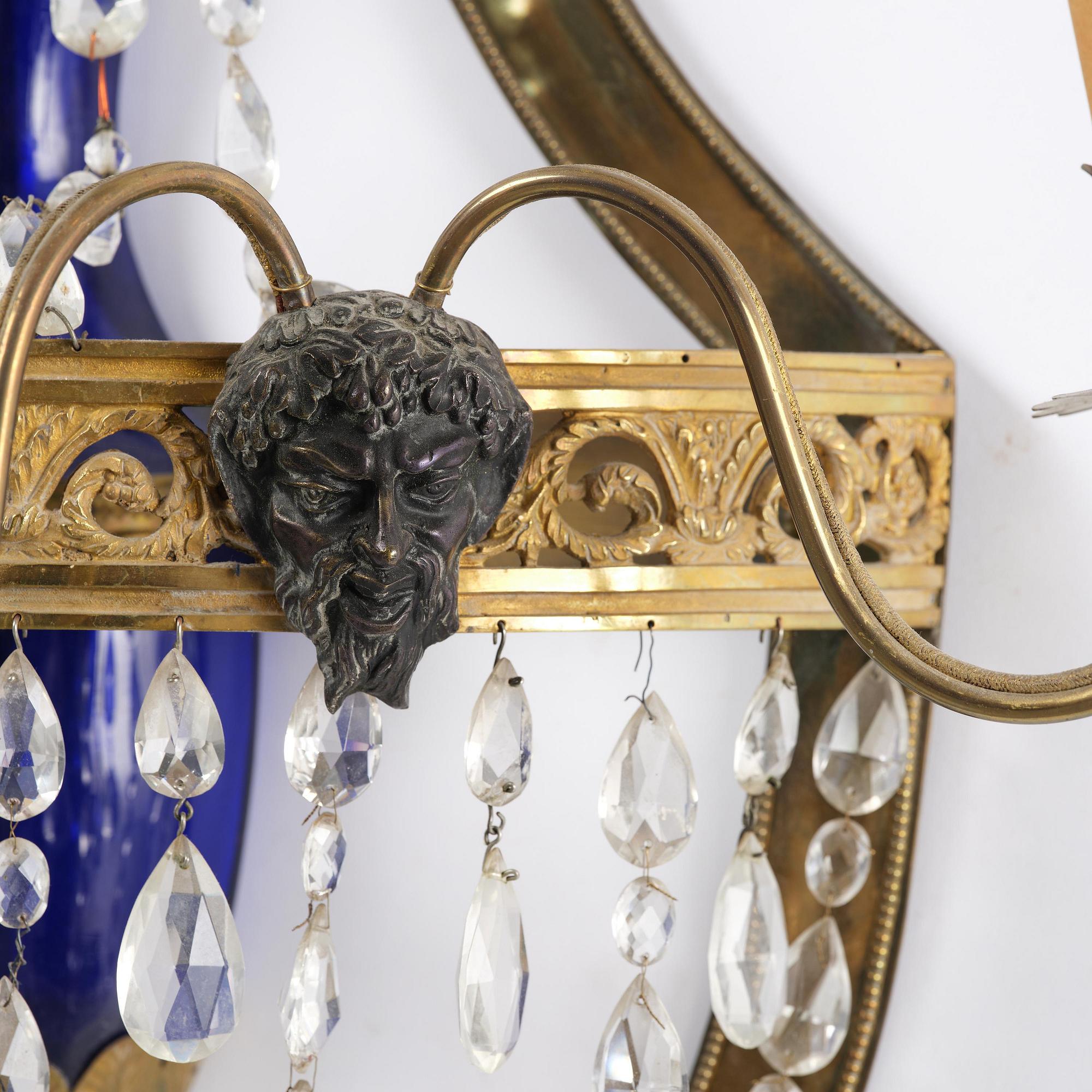 A pair of Russian Louis XVI-style  four-branch gilt bronze appliques, 19th century.