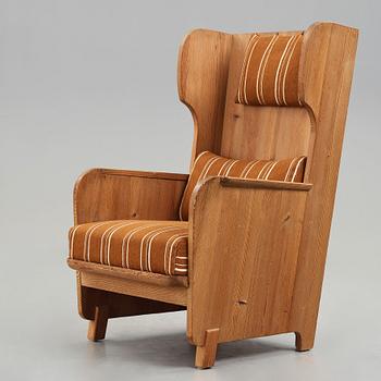 Axel Einar Hjorth, a "Lovö" stained pine armchair, Nordiska Kompaniet, Sweden, 1930's.