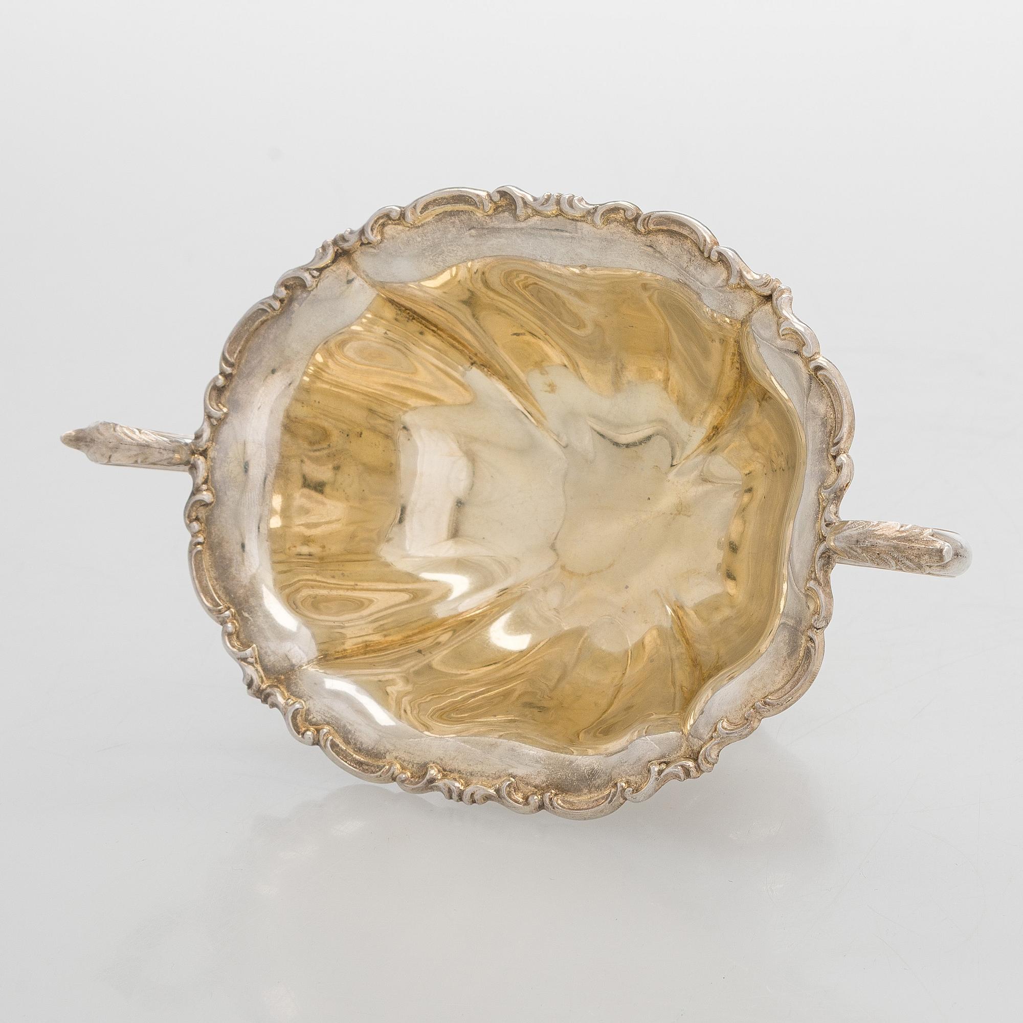 A silver coffee pot, sugar bowl, cream jug, and sugar tongs, Finland 1926-49.