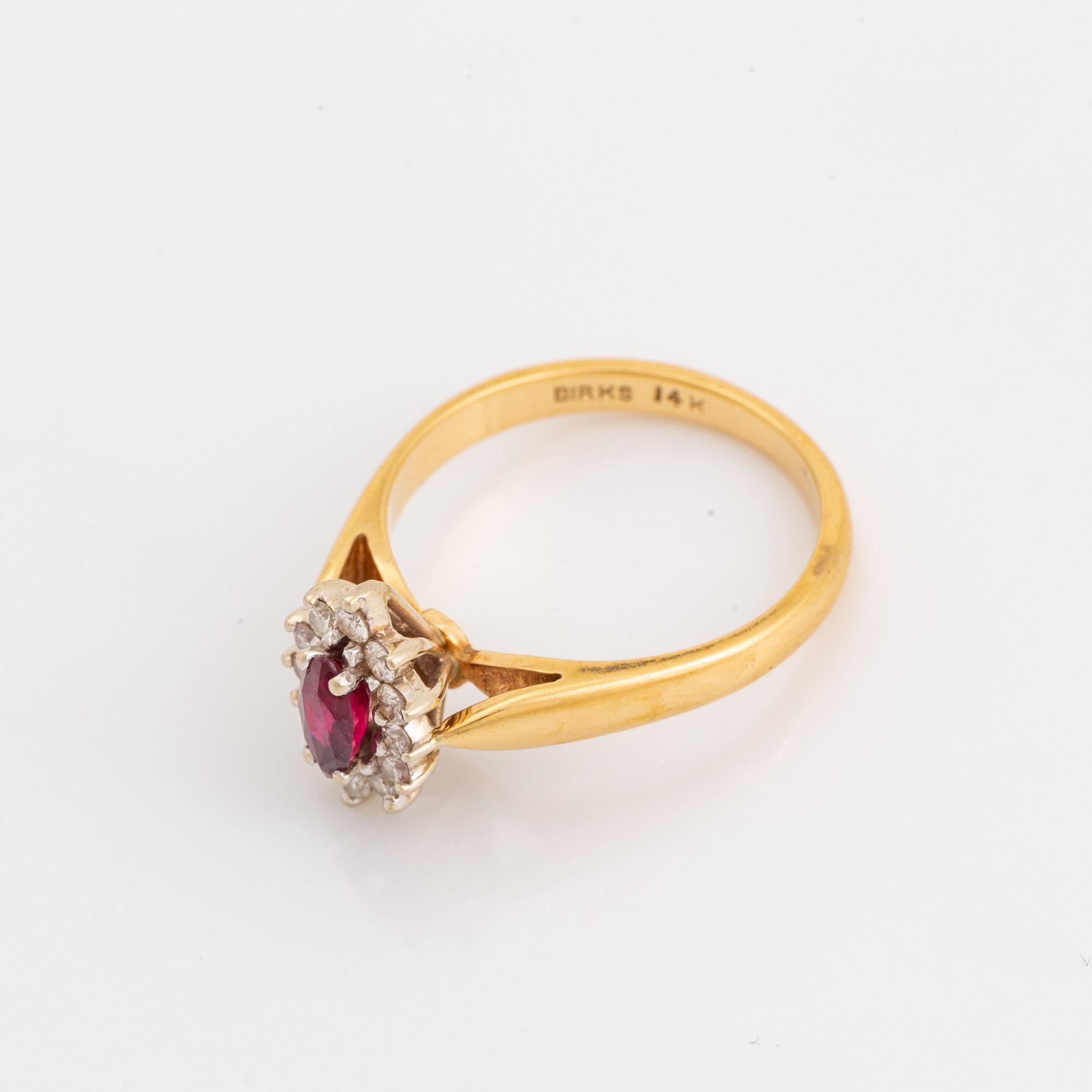 Navette cut ruby and brilliant cut diamond ring.