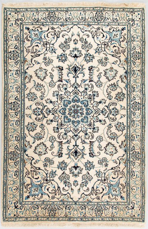 A carpet, Nain Part Silk. Ca 185 x 123 cm.
