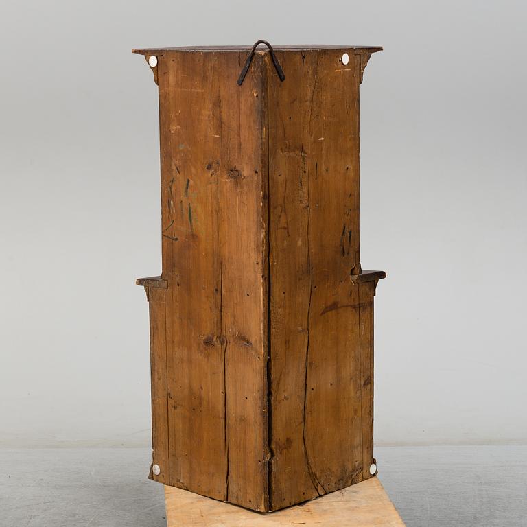 A 19th century corner cabinet.