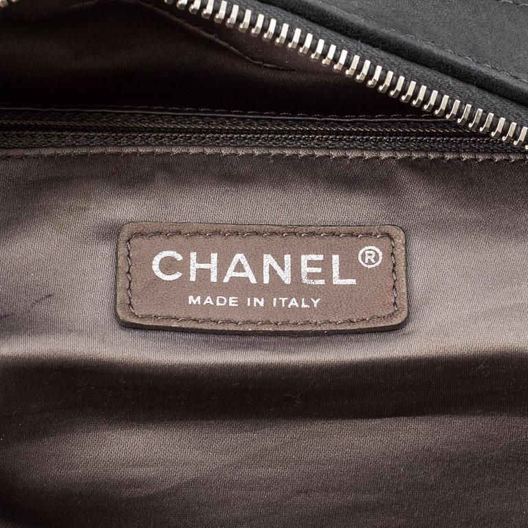 Chanel, a grey leather bag.