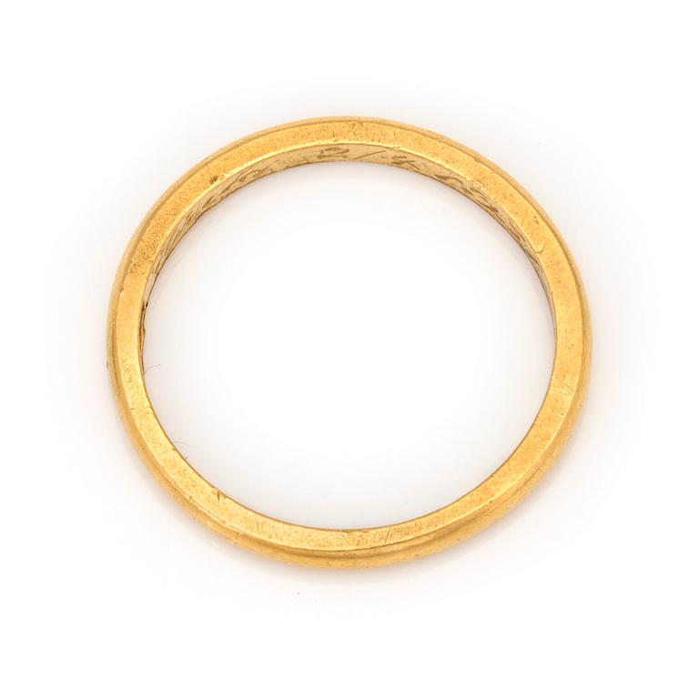 A 23K gold ring.