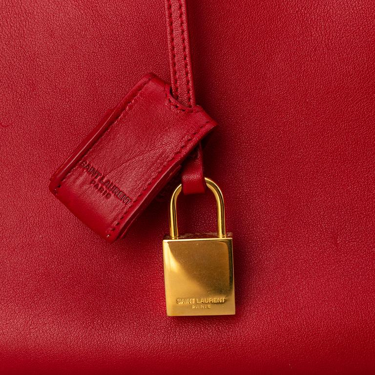Saint Laurent, a red leather 'Sac du Jour Small' bag.