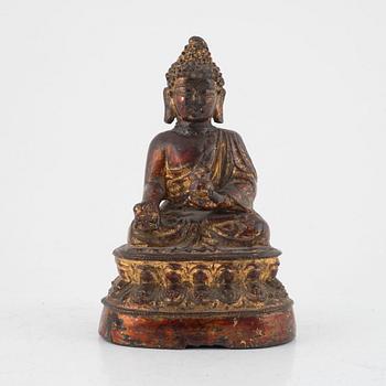 A seated bronze figure of Buddha, probably late Ming dynasty (1368-1644).