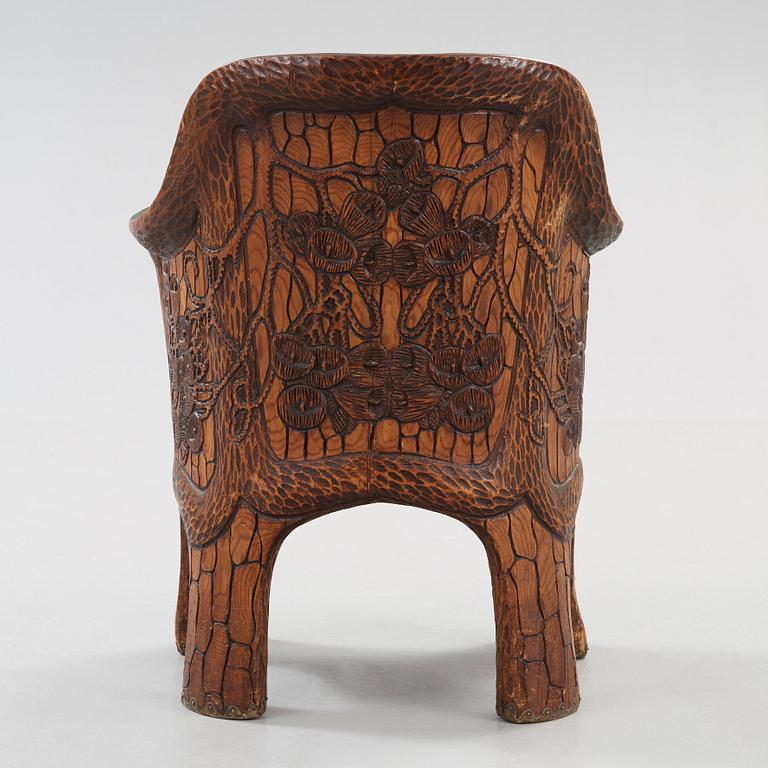 A Gustaf Fjaestad Art Nouveau carved pine chair 'Stabbestol', by Adolf Swanson, Arvika, Sweden 1908.