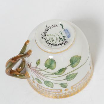 Royal Copenhagen, cream jug with lid and saucer, as well as coffee cup with saucer, porcelain, Flora Danica, Denmark.