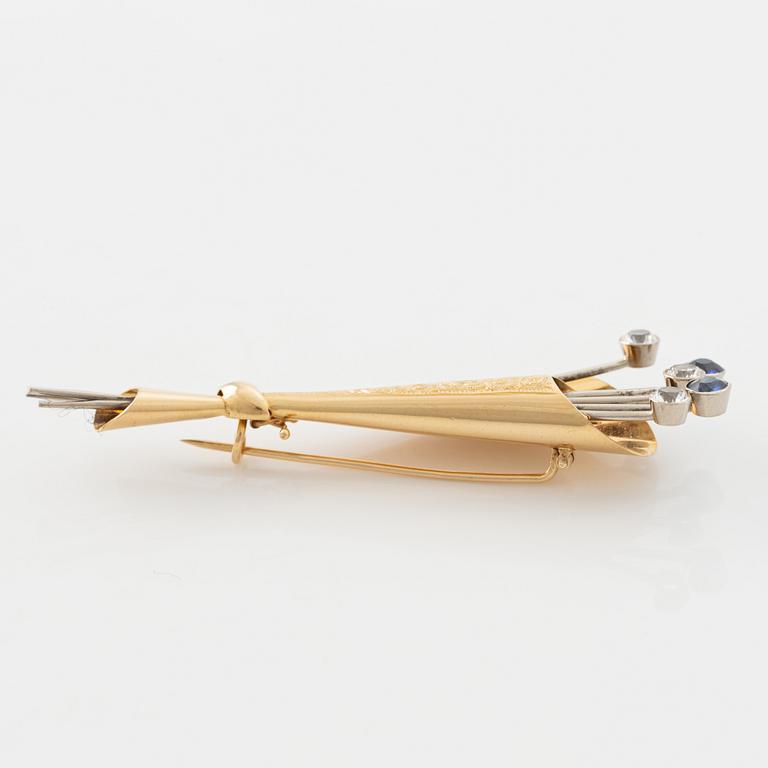 18K gold, white and blue sapphire brooch.