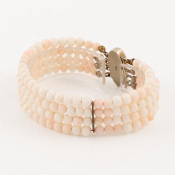 Bracelet with light pink coral, four strands.