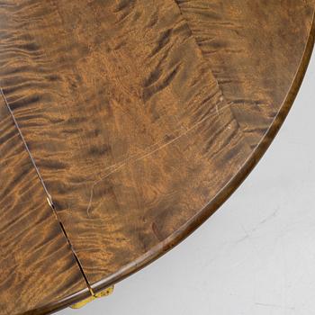 Dining table, circa 1900.