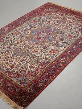 Matto, a semi-antique silk Kashan, ca 212,5-214,5 x 134,5-135,5 cm.