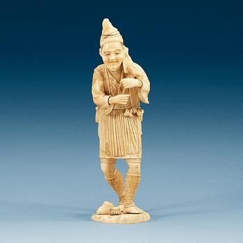 1607. A Japanese ivory figure of a man, Meiji (1868-1912).