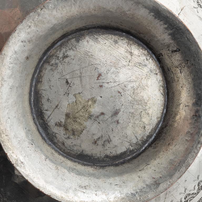 A west Asian repoussé silver and copper vessle, circa 1900.