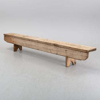 A pine bench, 19th Century.