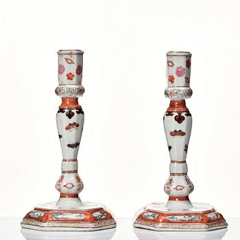 A pair of rouge de fer and grisaille export candle sticks, Qing dynasty, Qianlong (1736-95).