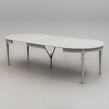 A Gustavian style dining table and ten chairs, 20th century.