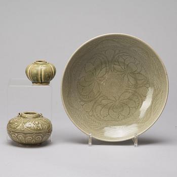 Two olive green glazed jars and a dish, South East Asia, 14th/15th Century.