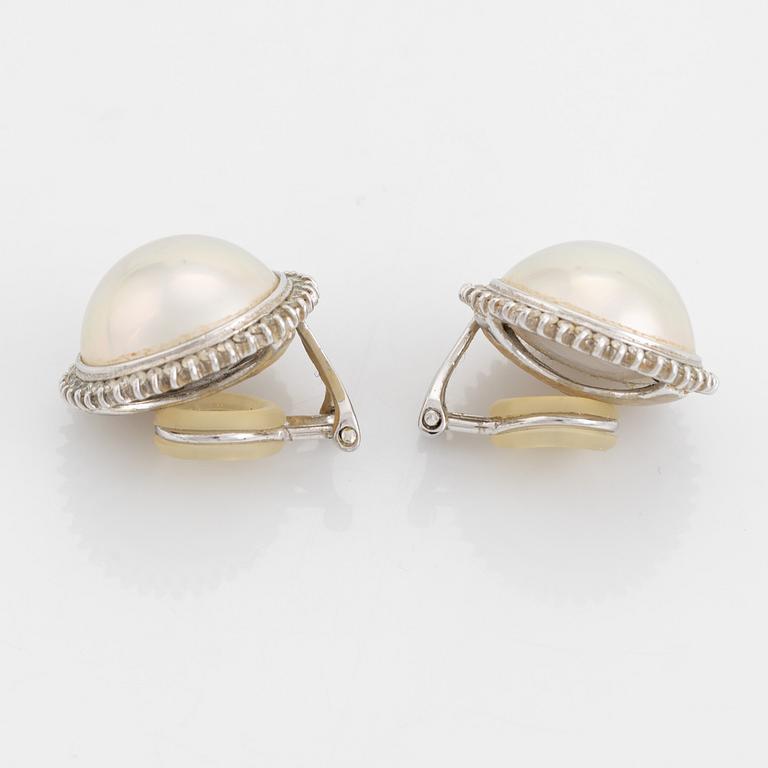 Mabe pearl and brilliant cut diamond earrings.