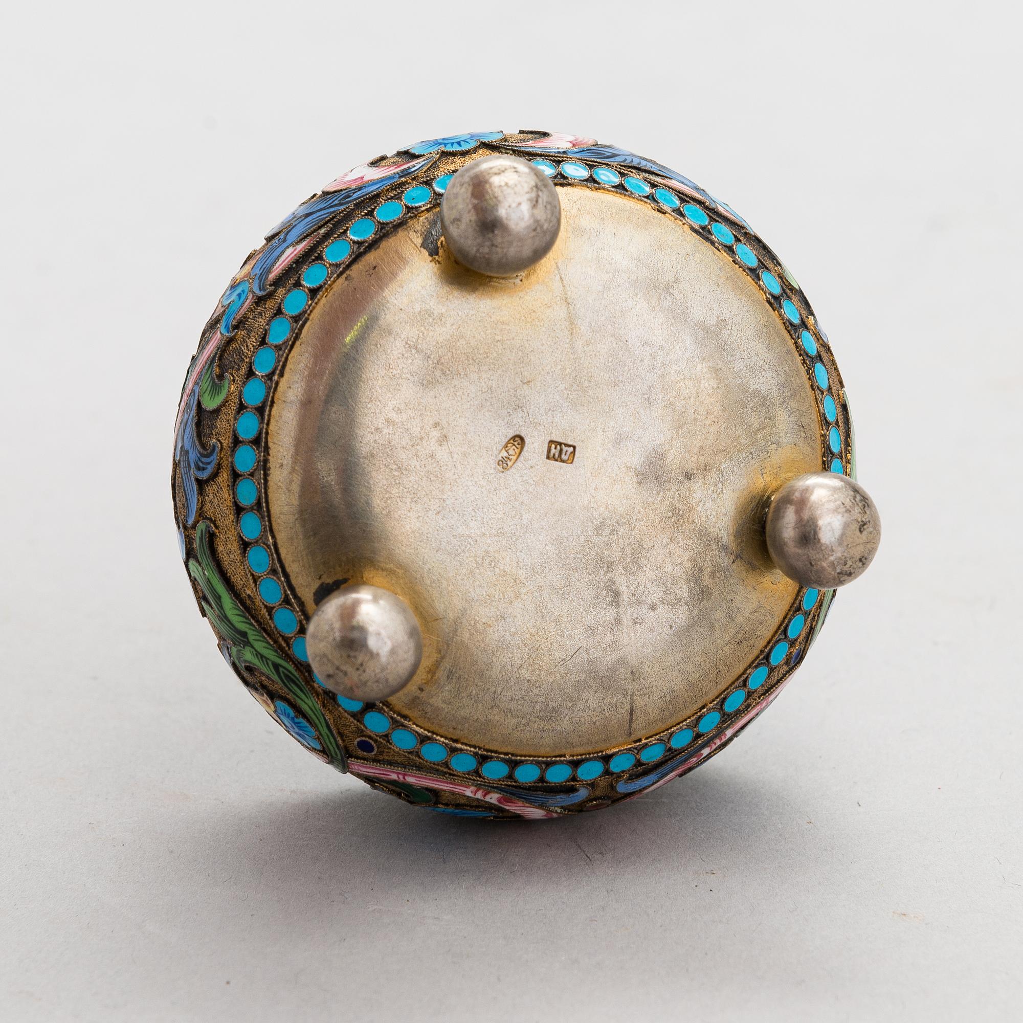 A salt cellar, mark of D. Nikitin, and 2 spoons, poss. P. Abrosimov and M. Andreyevna, enamel, silver. Moscow 1899-1908.