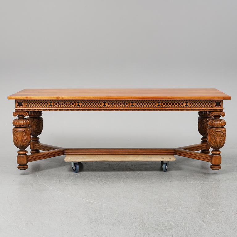 A 20th century baroque-style mahogany table.