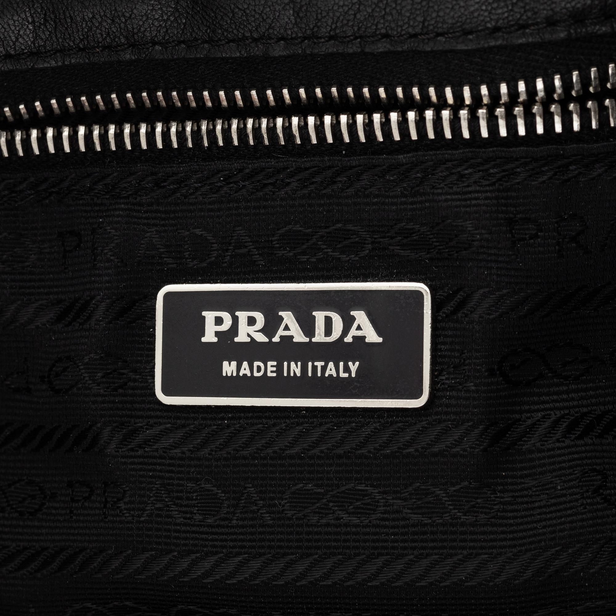 Prada, A black leather bag.