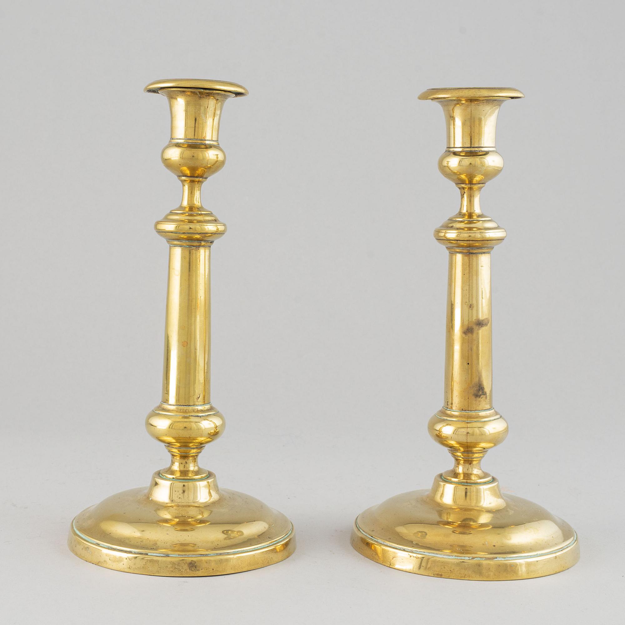 A pair of bronze Rmpire candlesticks, first half of he 19th century.