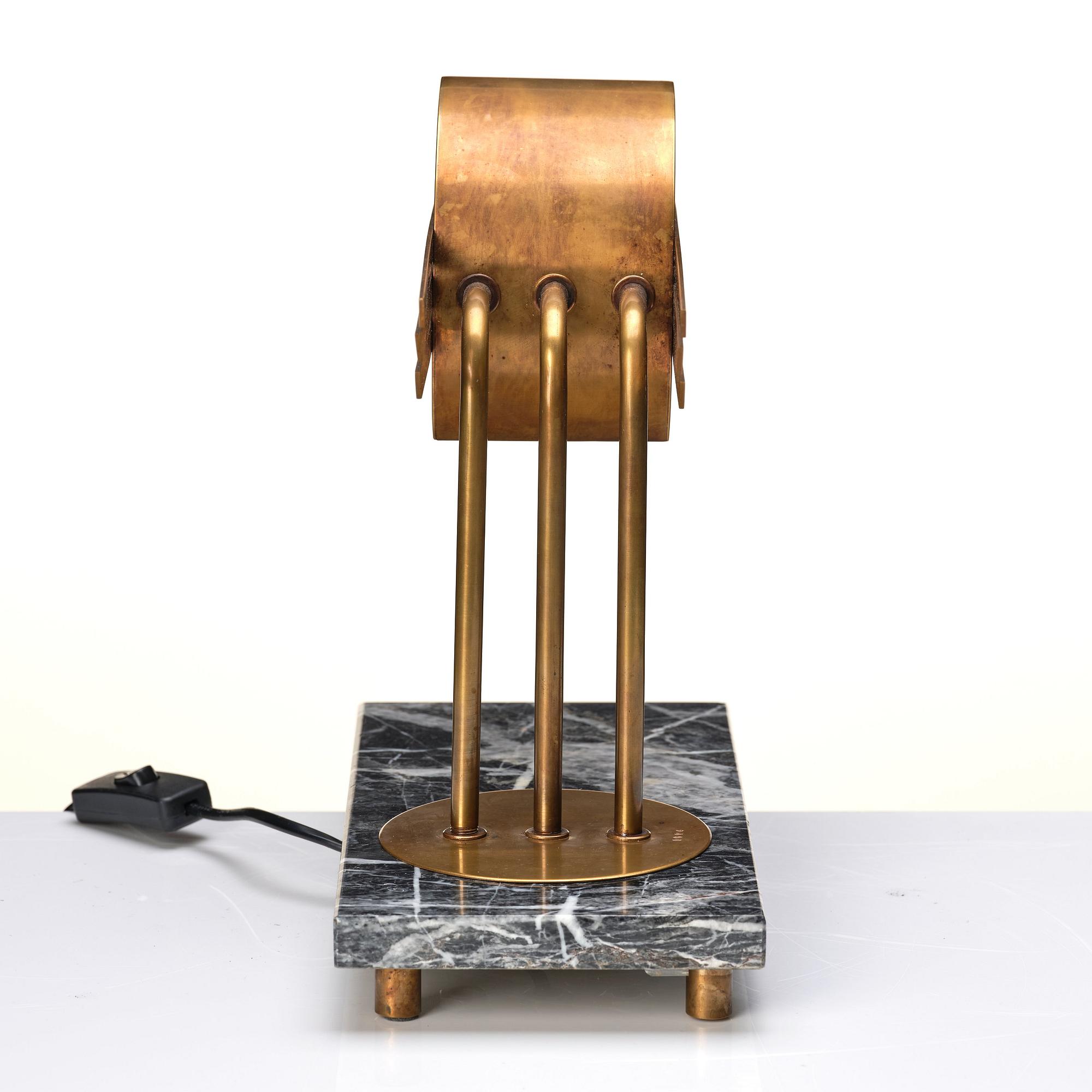 An Austrian brass and black marble table lamp, marked Vienna 1928.