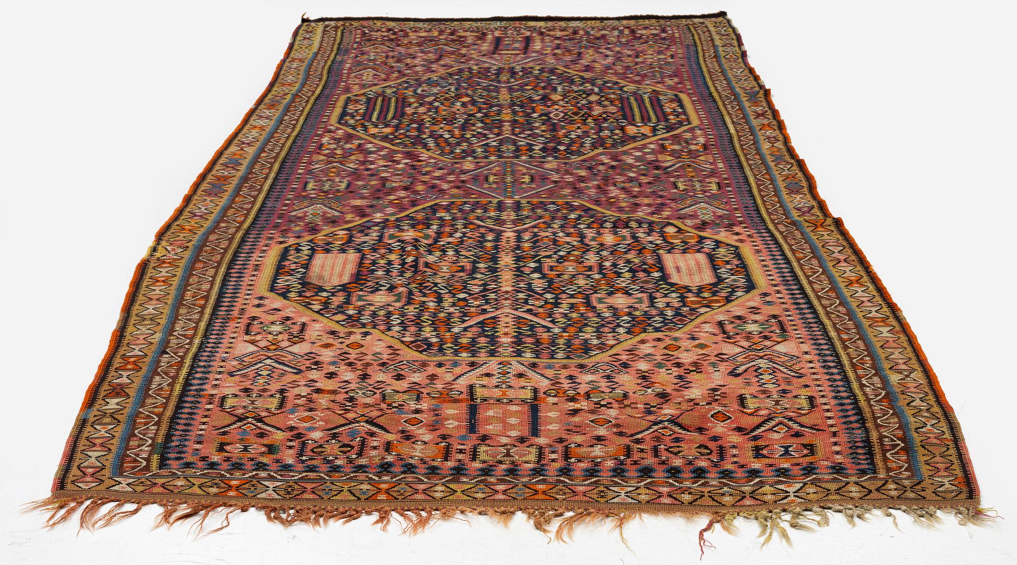 An antique kilim, southeastern Anatolia/Caucasus, c. 398 x 176 cm.