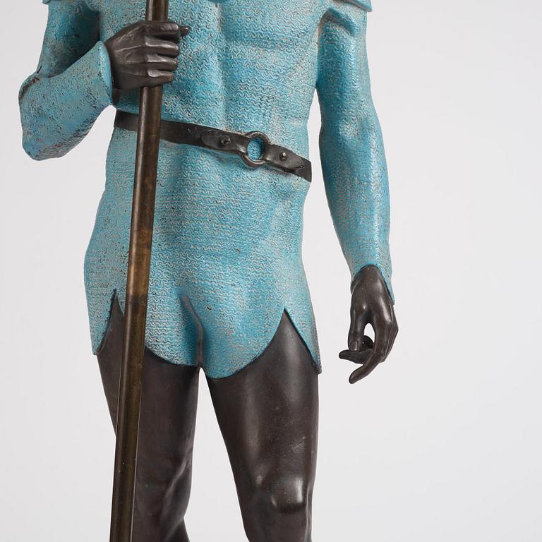 A bronze sculpture of a man in armour, late 19th century.