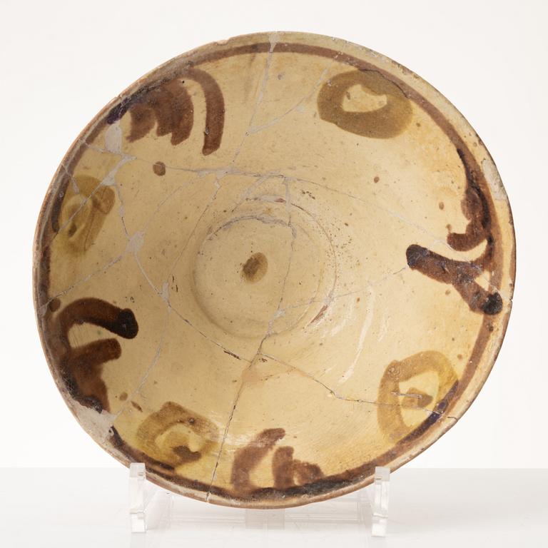 A glazed earthenware bowl, possibly Hispano-Moresque.
