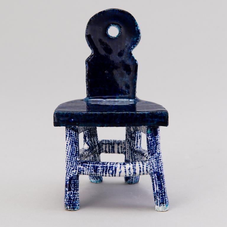 HEINI RIITAHUHTA, a porcelain miniature sculpture 'Chair' signed Heini Riitahuhta.