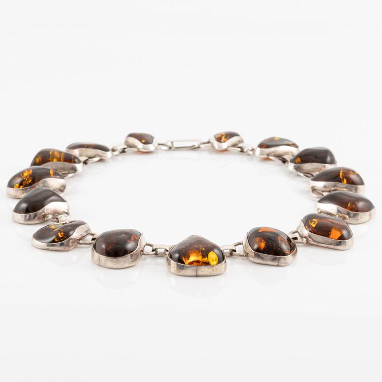 Necklace, sterling silver and amber.