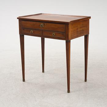 A late Gustavian mahogany writing table from araound the year 1800.