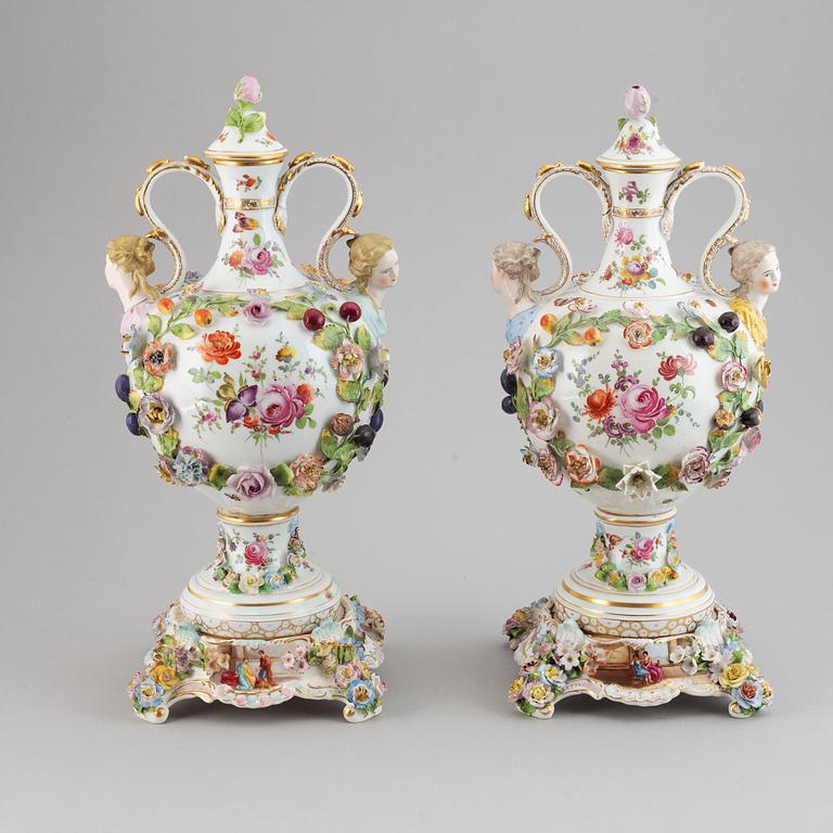 A pair of enamelled earthenware vases with covers, 20th century.