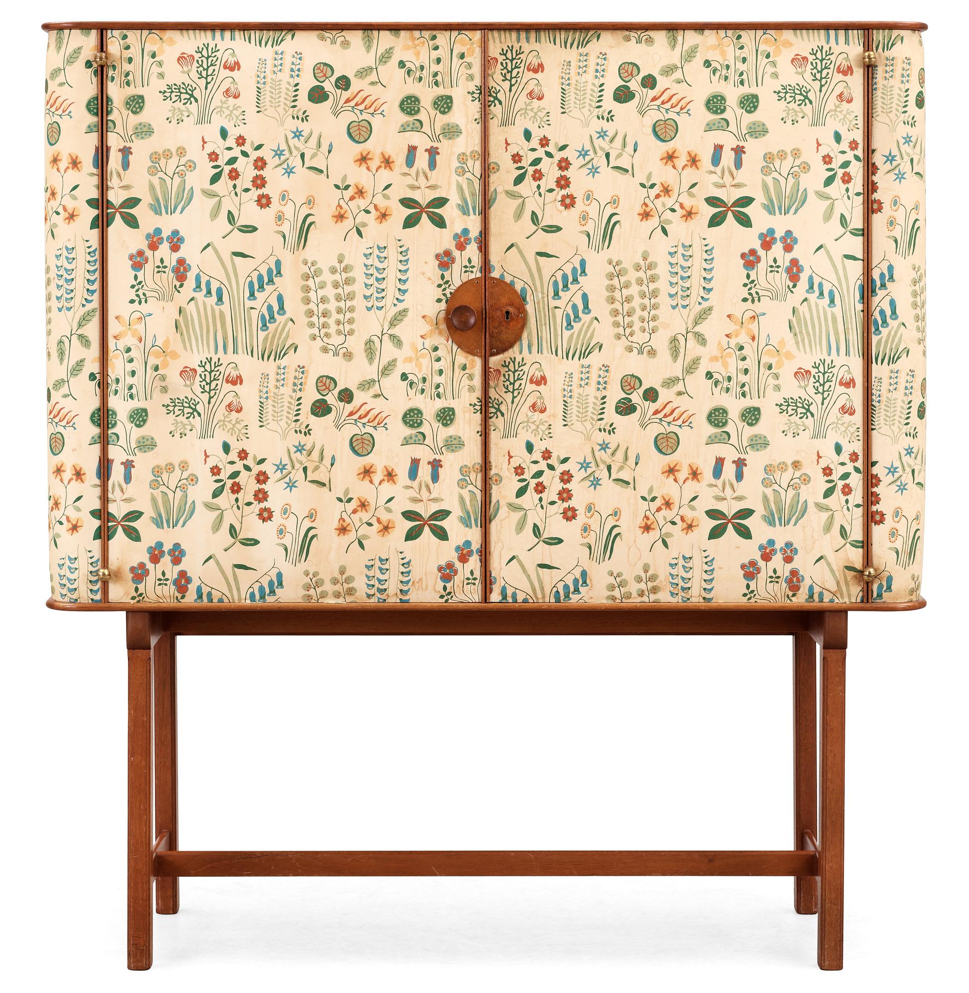 A Josef Frank mahogany cabinet, doors and sides covered in Frank's floral chintz fabric 'Fatima', Svenskt Tenn ca 1937.
