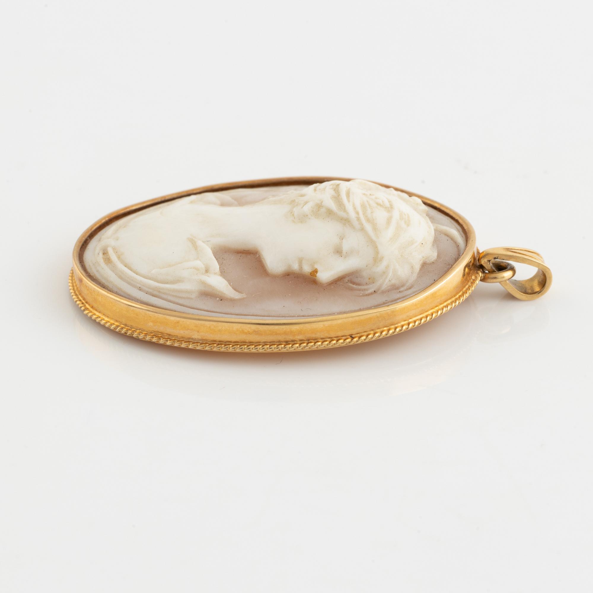 Carved shell cameo pendant.