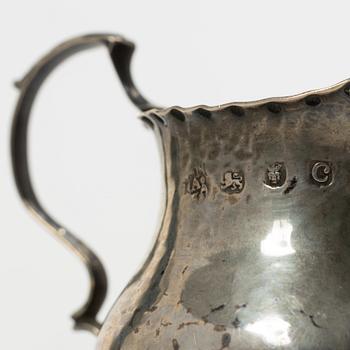 Two silver casters and cream jug, England.